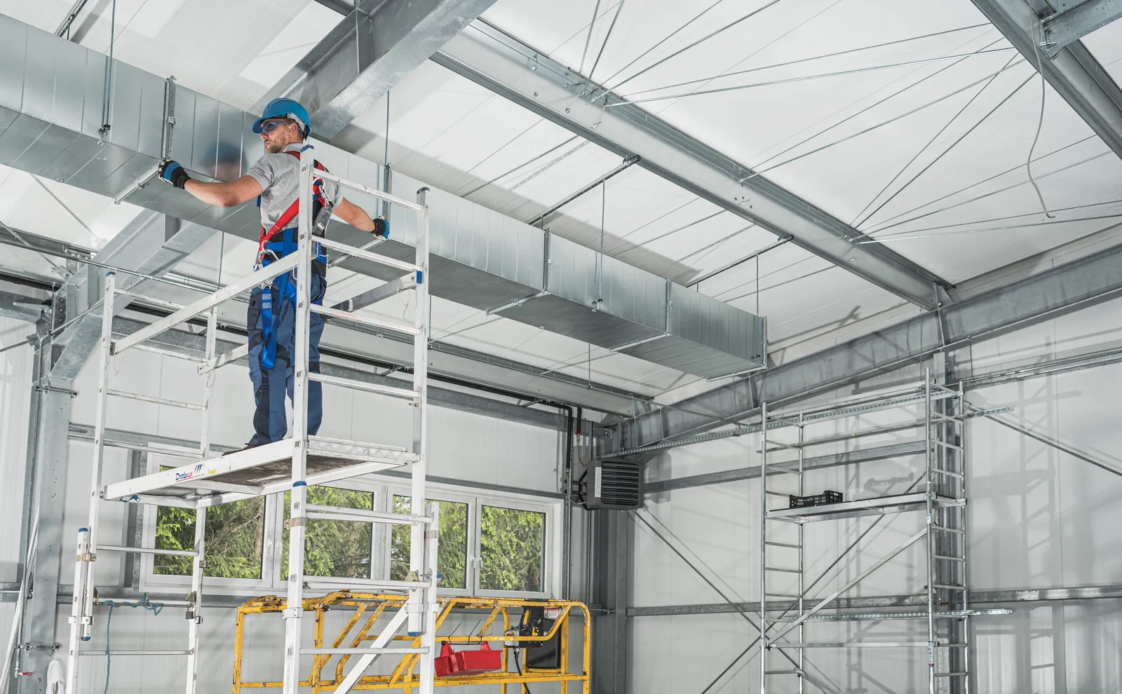 worker standing on a scaffold